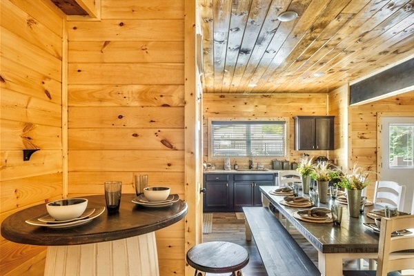 This kitchen is a testament to sophisticated living, with a professional-grade range, a Keurig combo brewer, and a delightful dining area