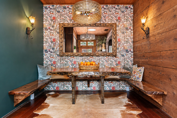 Thoughtful renovations revealed fourteen-inch redwood planks in the now breakfast nook, paired with a live-edge table made from a fallen Santa Barbara tree. A warm little place for coffee, cards and lingering over breakfast.