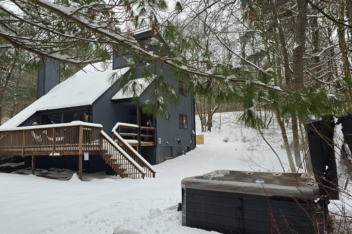 Soak in the hot tub under the stars, just a few feet from the cabin deck