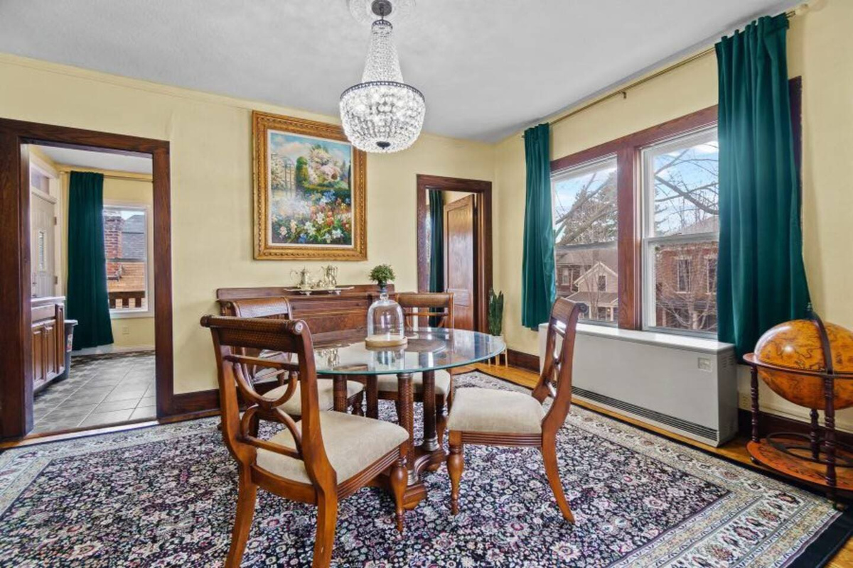 Cozy 4-seater dining area with a window, providing a bright and inviting space for meals and gatherings.