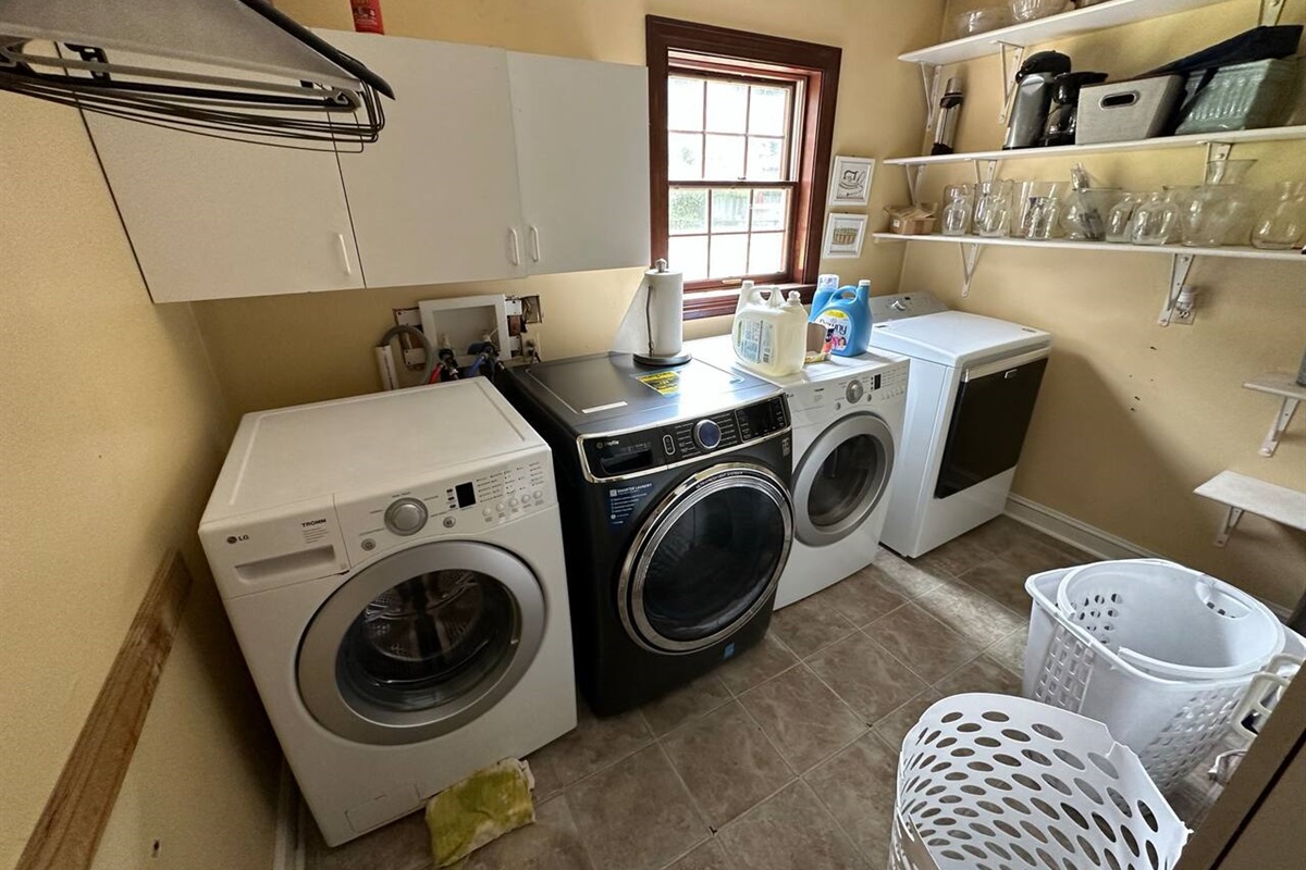Utility room on 1st floor has 2  washers and 2 dryers