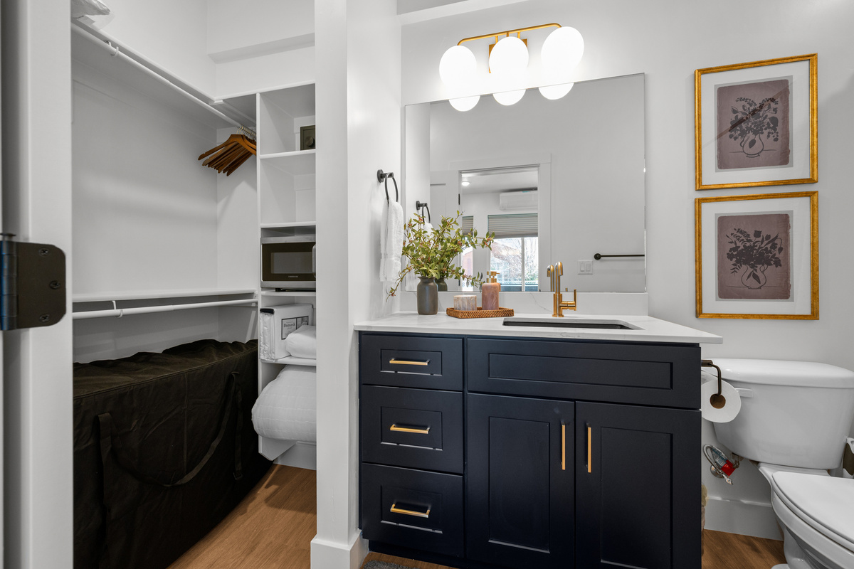 Fresh, modern bathroom finishes create a clean and comfortable space for getting ready.