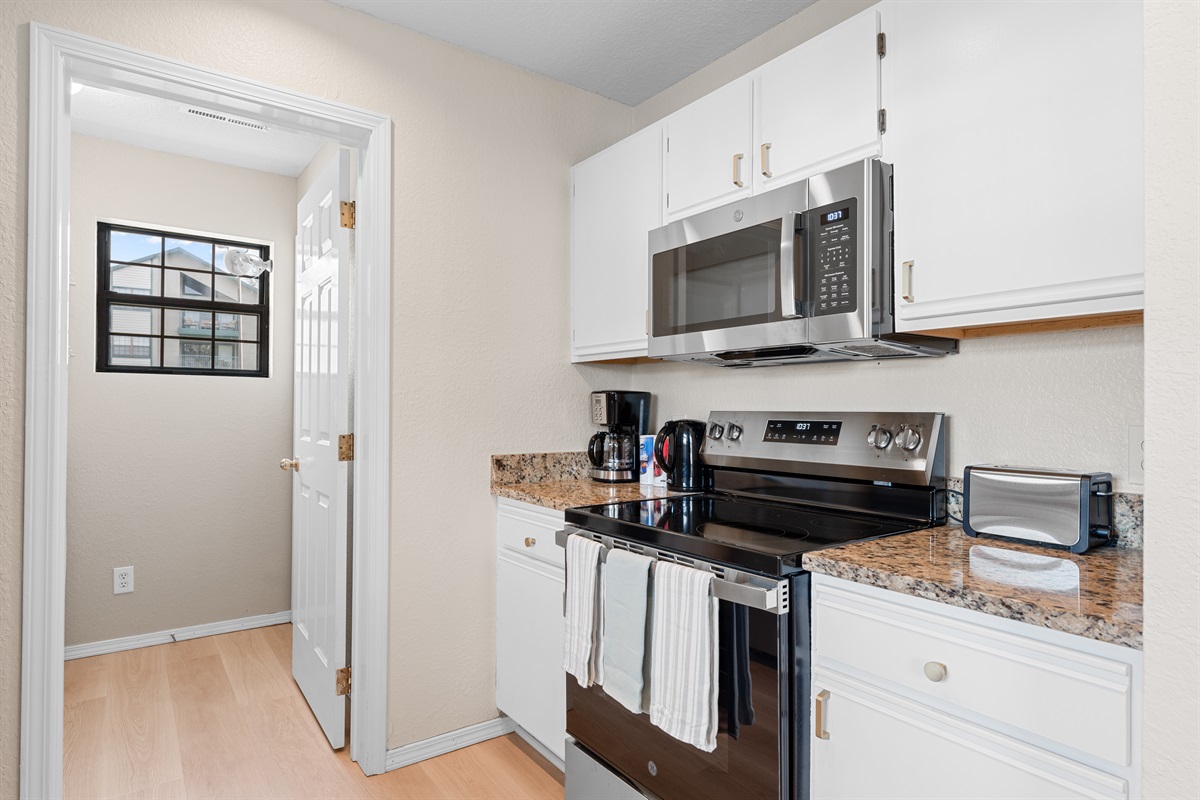 ☕ Wake up to fresh coffee or wind down with a late-night snack—this kitchen includes everything from a Keurig and coffee maker to toaster and kettle.