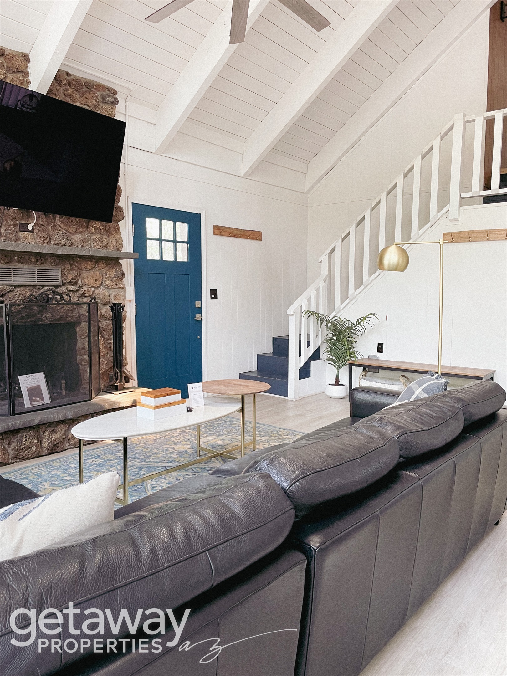 Warm, inviting living room with fireplace and smart TV — ideal after a day in the White Mountains
