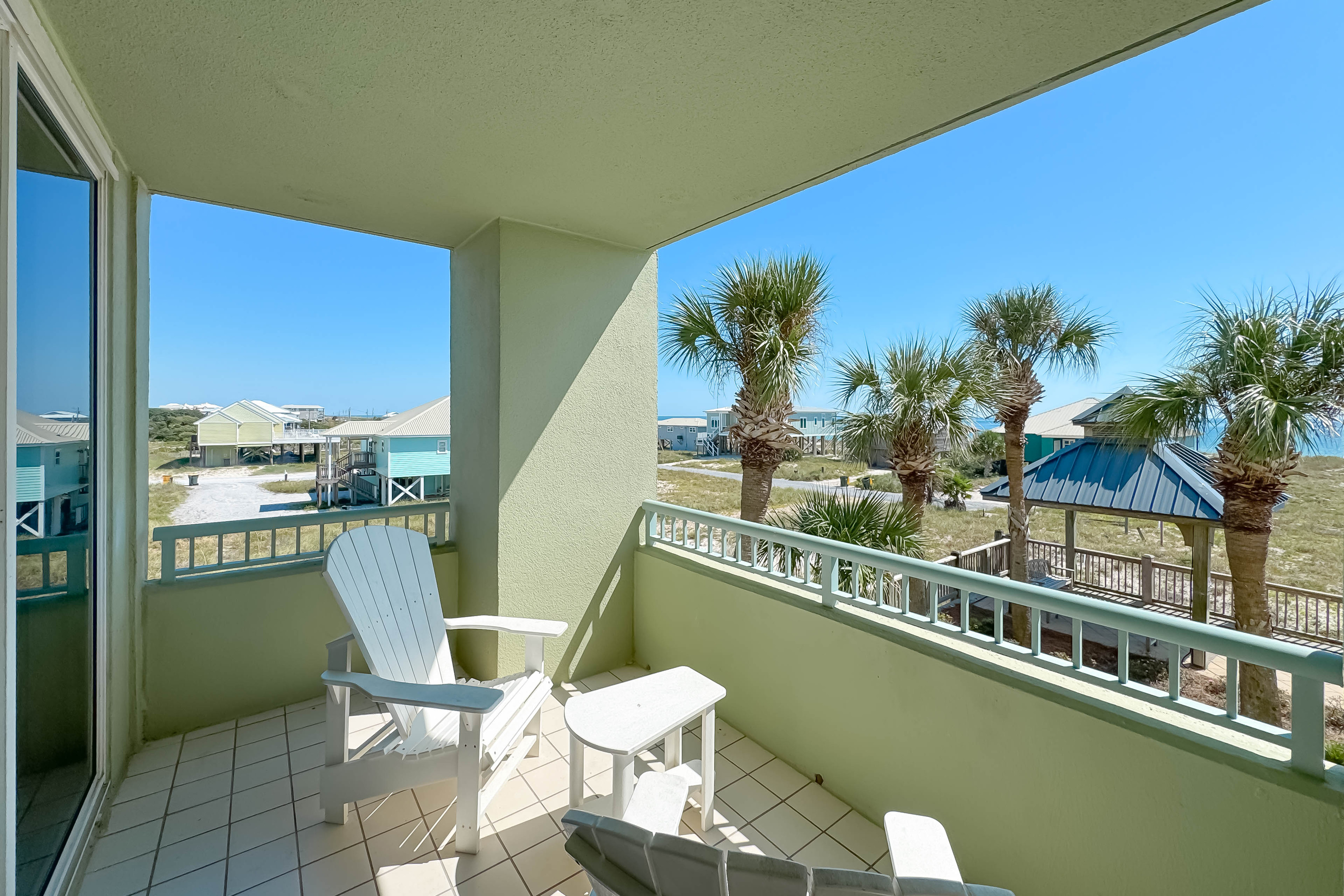 Enjoy seamless indoor-outdoor living with this 2nd-floor balcony overlooking the beach.