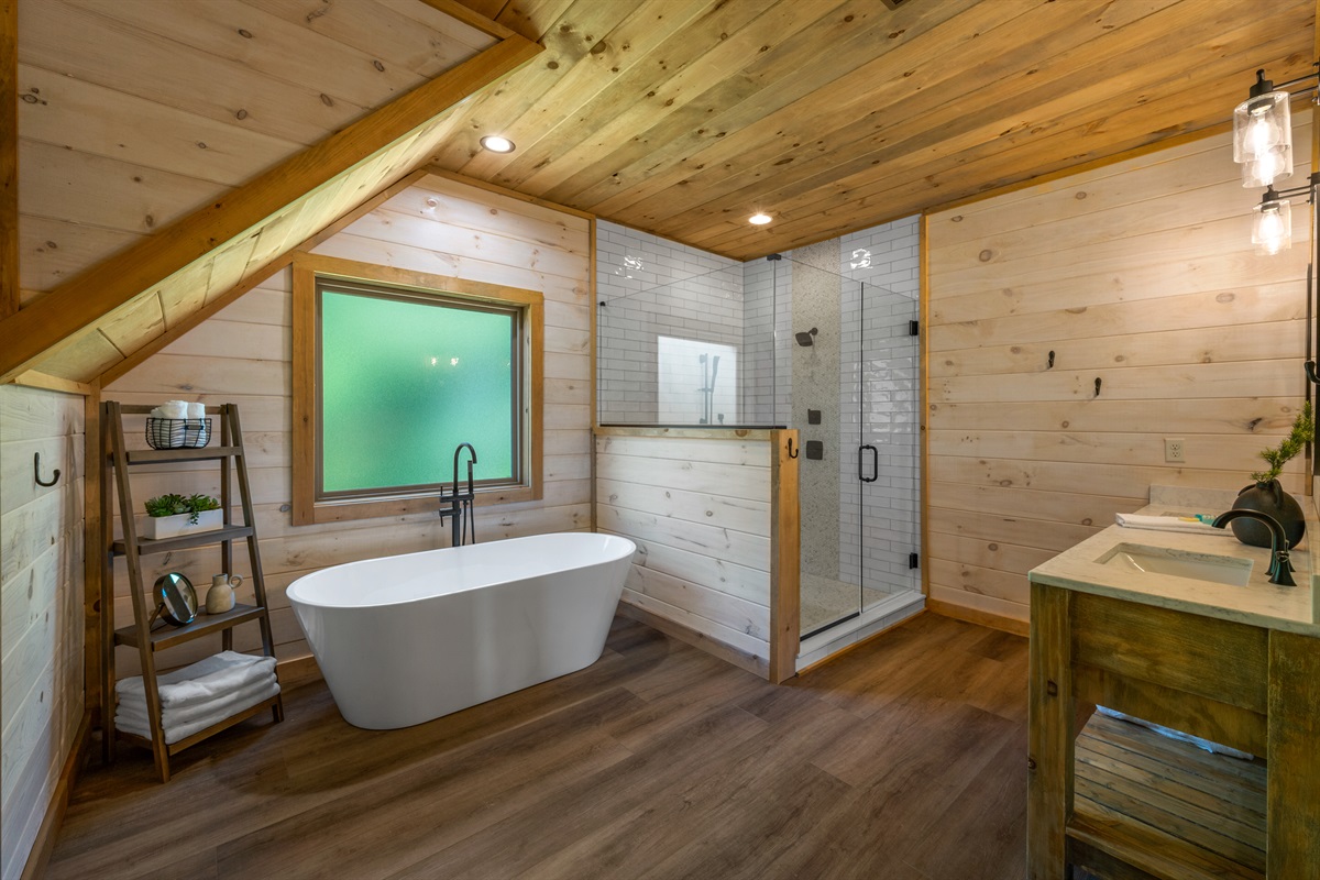 Upper Level Suite has a large bathroom attached with a huge shower and separate soaking tub. 