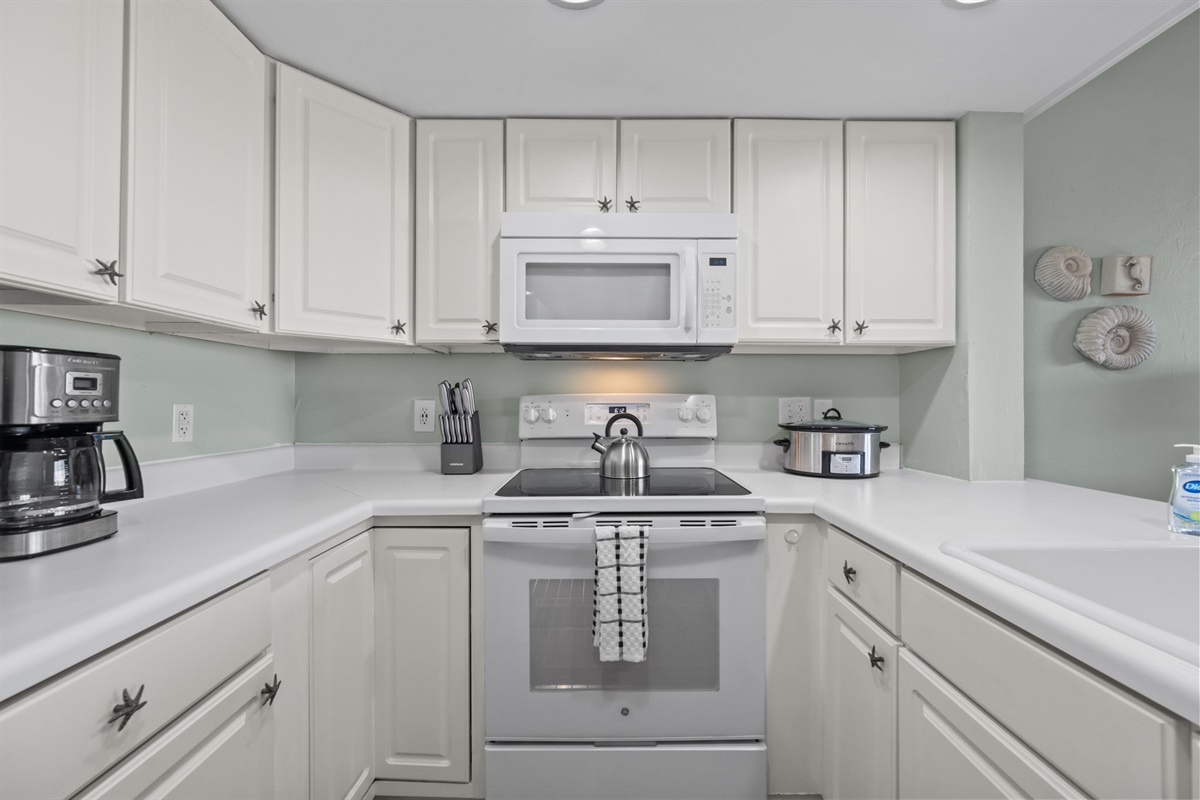 Fully equipped kitchen with coffee maker, crockpot, and all the essentials for easy meals
