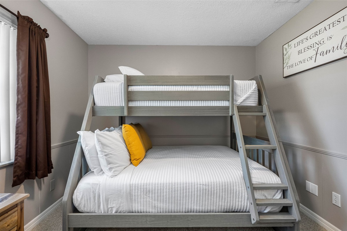 The bunk bed provides flexible sleeping arrangements, making this room an excellent choice for visiting family or friends.