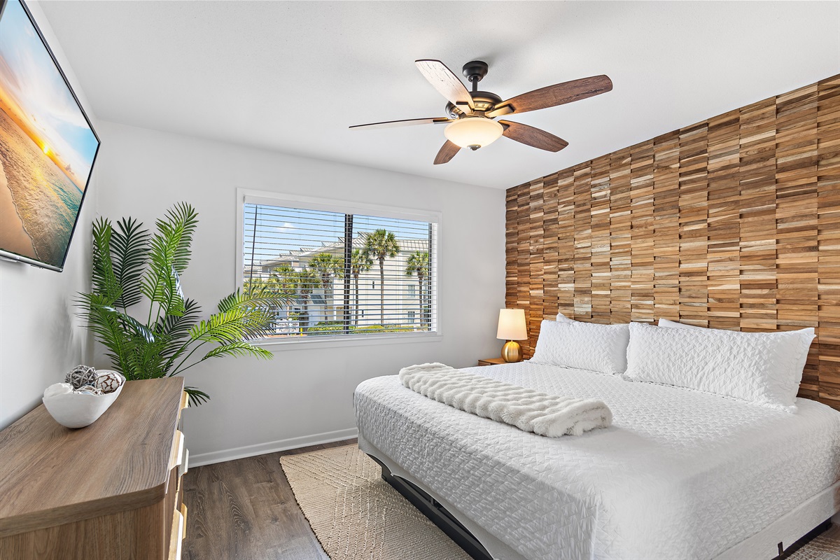 3rd Floor - Bedroom 2: King bed, ensuite bathroom with remodeled shower/tub combo, view of Scenic Gulf Drive, Smart TV (Sleeps 2)