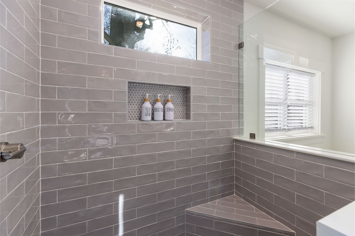 The walk-in shower has a small shower bench, window for natural light - and we provide shampoo, conditioner, and body wash. 