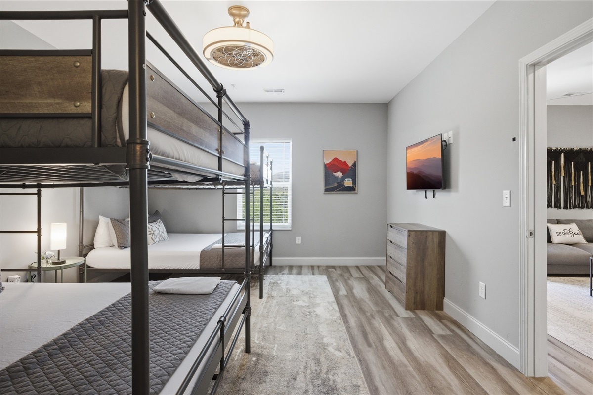 There’s a rhythm to this room in Unit 2—bags tucked away, people coming and going, and enough space to keep it all from feeling chaotic. It just works.