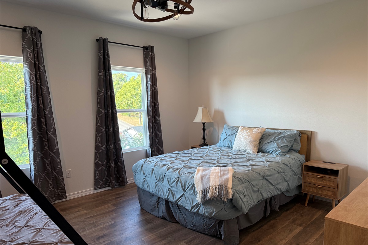 Bedroom #3 has a Queen bed and a set of Bunks. Lower bunk in a Queen and upper is a twin xl. Room is large enough to provide this amount of bedding and still have room to move around. Dresser and night stands also in room