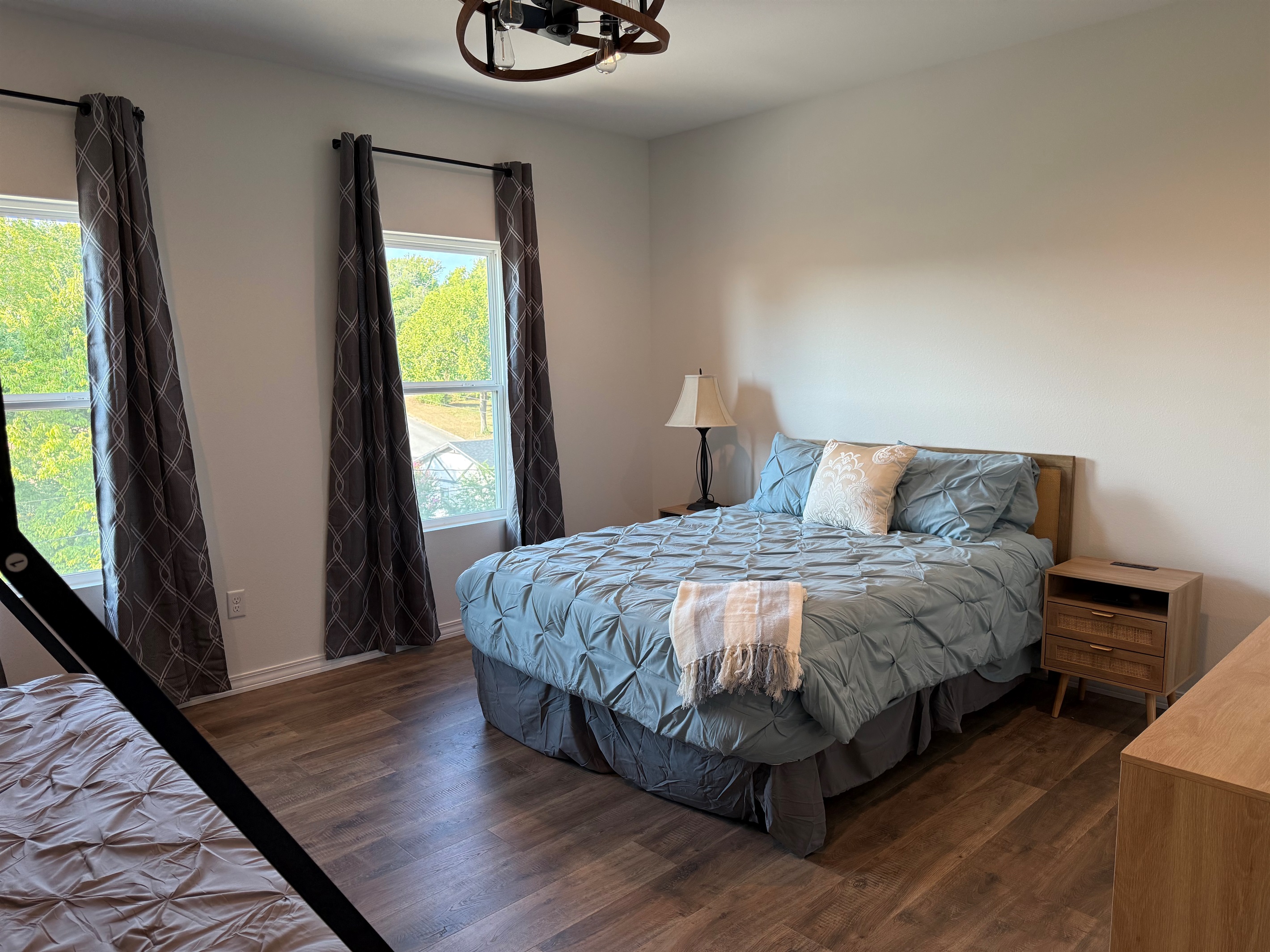 Bedroom #3 has a Queen bed and a set of Bunks. Lower bunk in a Queen and upper is a twin xl. Room is large enough to provide this amount of bedding and still have room to move around. Dresser and night stands also in room