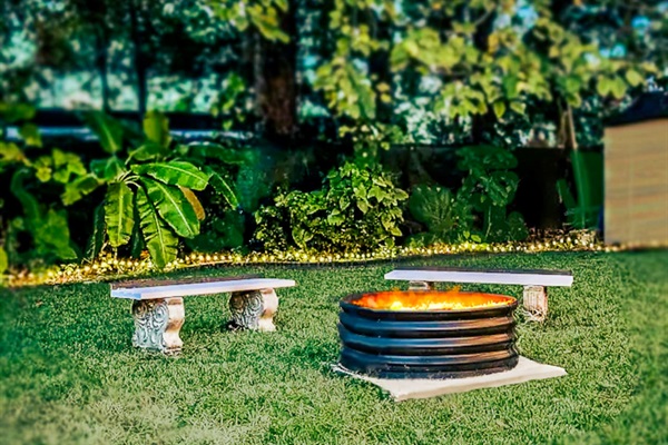 Private, grass covered, back yard area.FencedOutdoor lightingSmall gill.Fire Pit