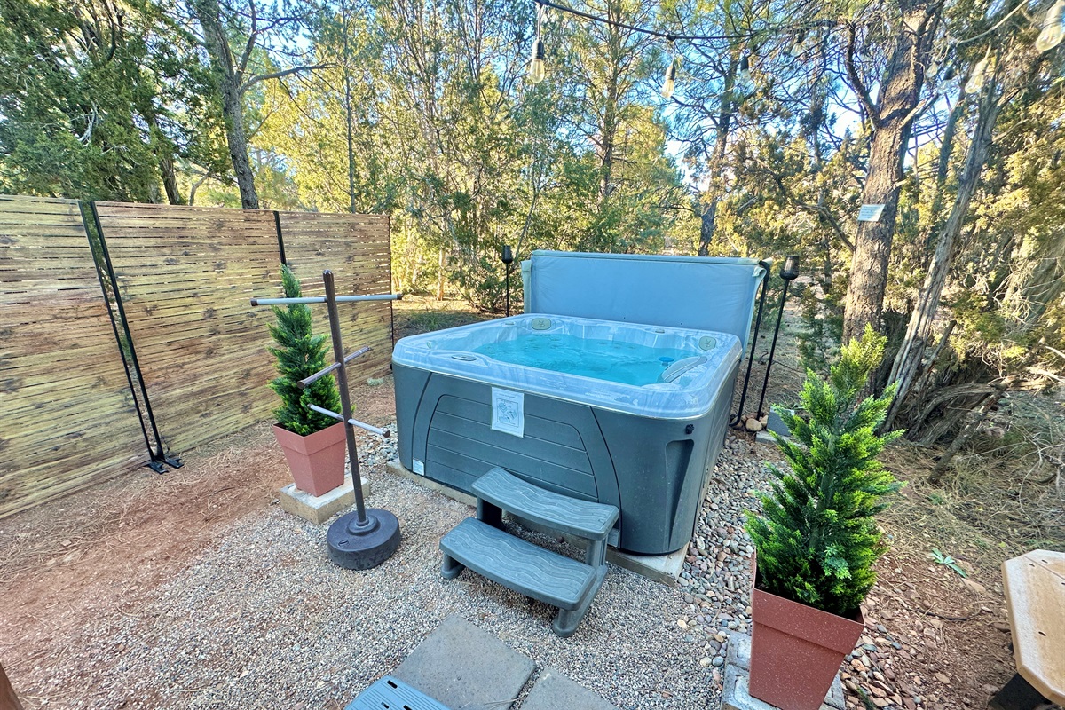 Large hot tub under the stars with privacy screens for relaxation and privacy!