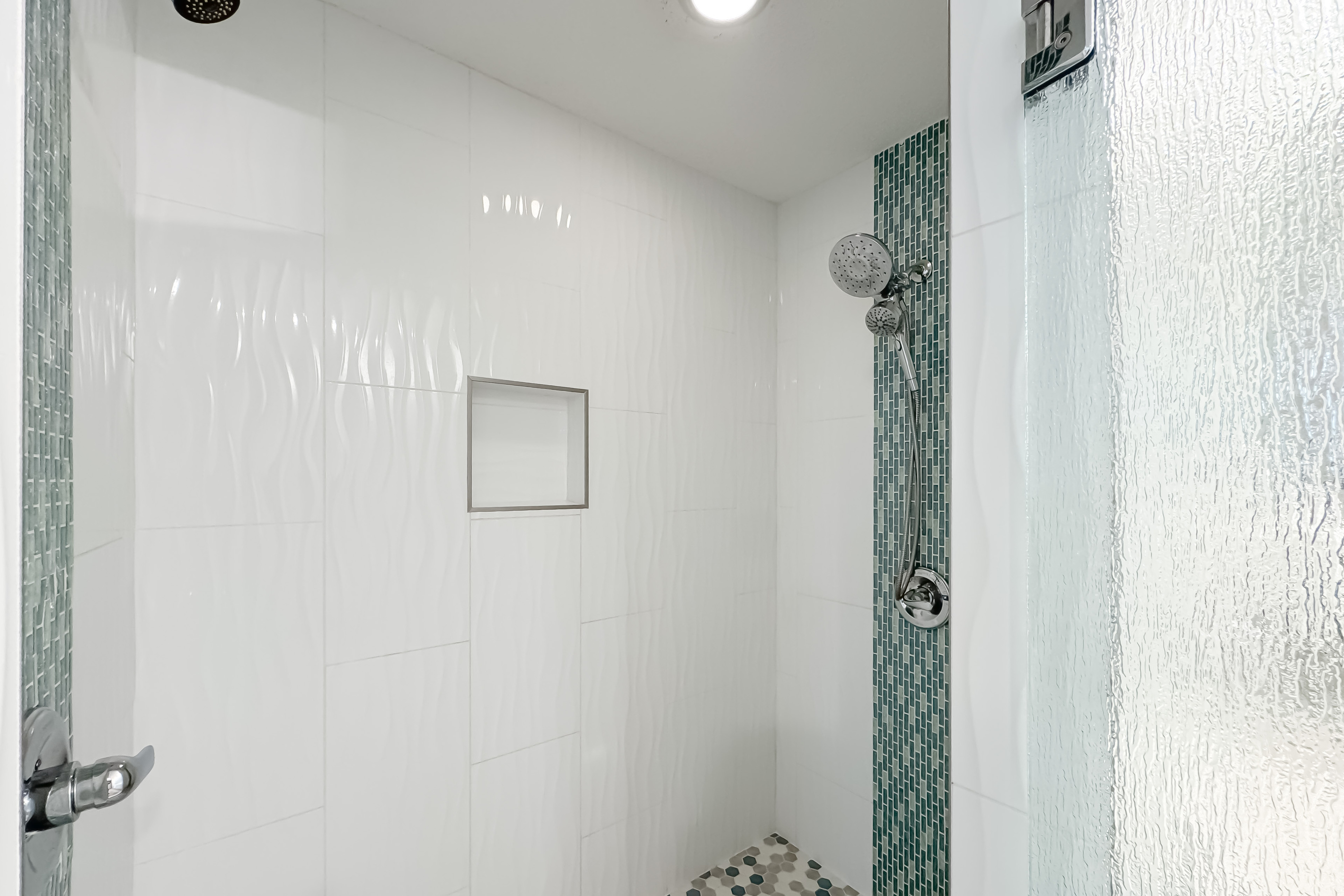 Modern updates meet classic comfort in this bathroom.  Clean lines and thoughtful design provide a relaxing experience.