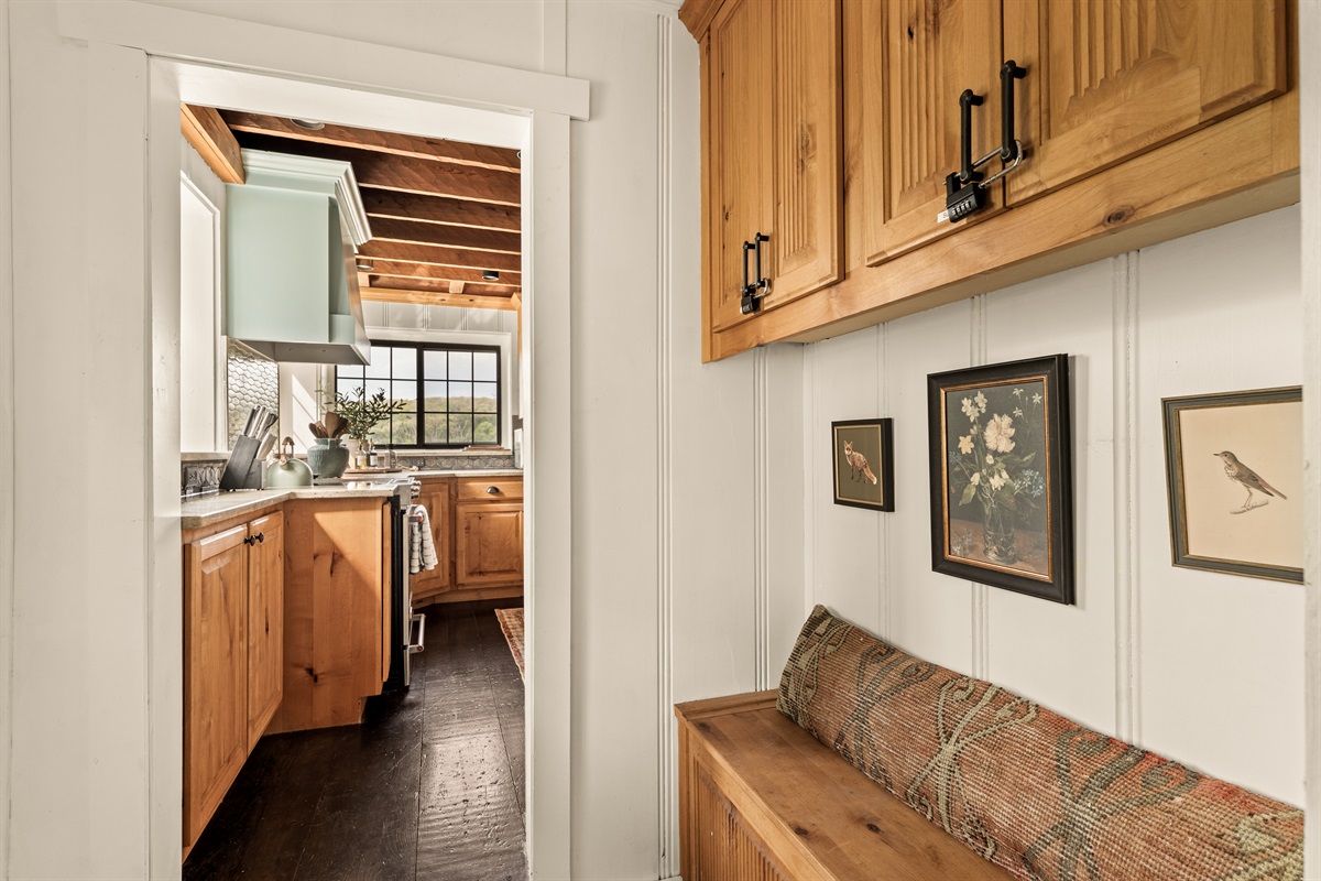 Charming nook with built-in bench seating—perfect for a quiet moment or slipping on your shoes.