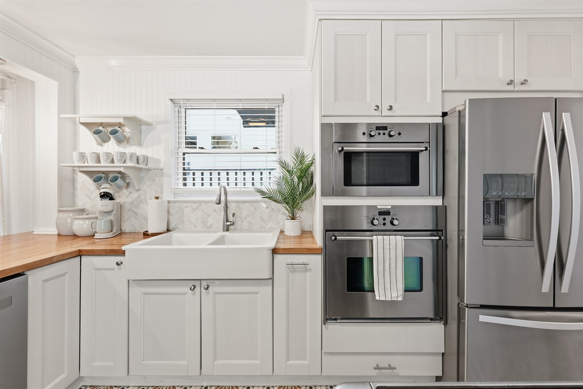 Large farmhouse sink and updated appliances give you all the conveniences of home