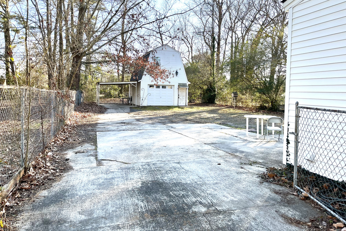 Williams Studio — Detached building exterior; guest space is upstairs and separate from downstairs storage.