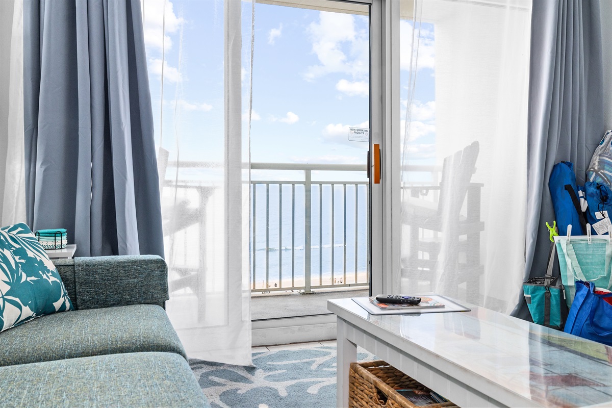 Bright, breezy living space that opens to the balcony.