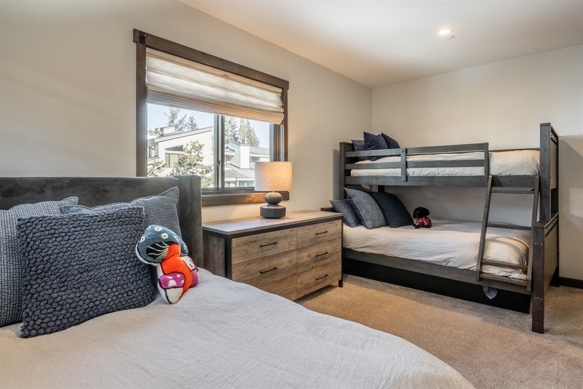 Located on the main floor, the bunkroom is designed for versatility, with multiple sleeping options and a TV—making it a comfortable, easy space for kids, friends, or extra guests.