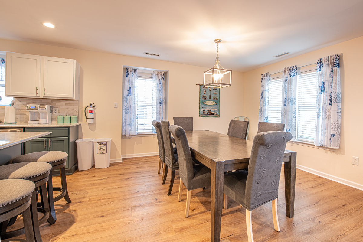 Dining Area with Dining Table, Seating, and Adjacent Kitchen