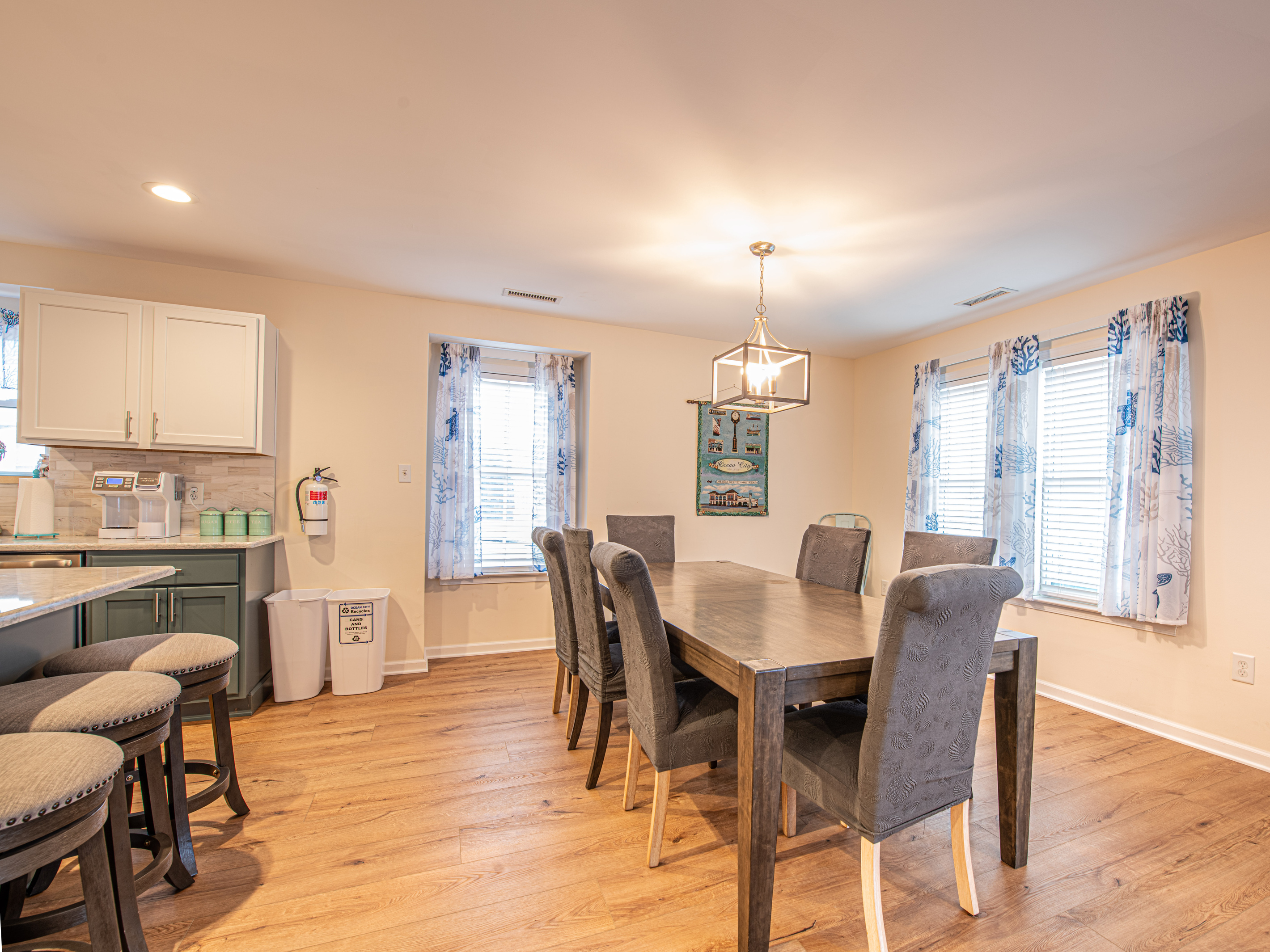 Dining Area with Dining Table, Seating, and Adjacent Kitchen
