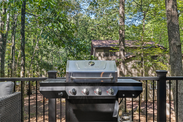 Grilling surface equipped with multiple burners, perfect for preparing meals for large groups simultaneously.