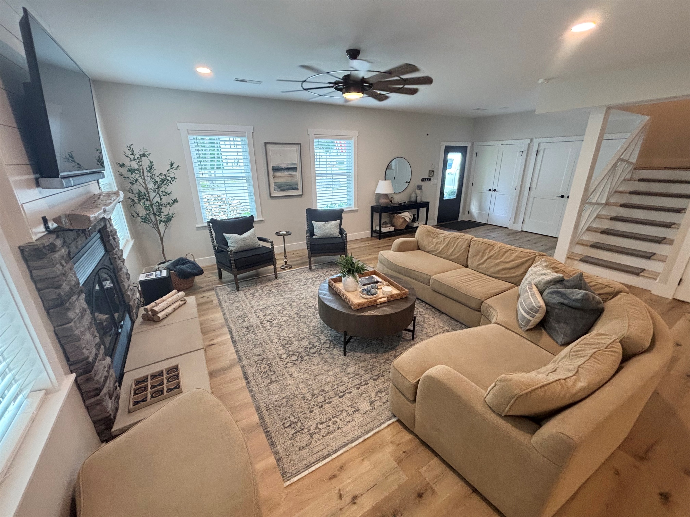 Relax in our spacious living area, featuring cozy seating, a stunning fireplace, and natural light pouring in through the windows. Perfect for family gatherings or a quiet retreat. Experience comfort and style in every corner!