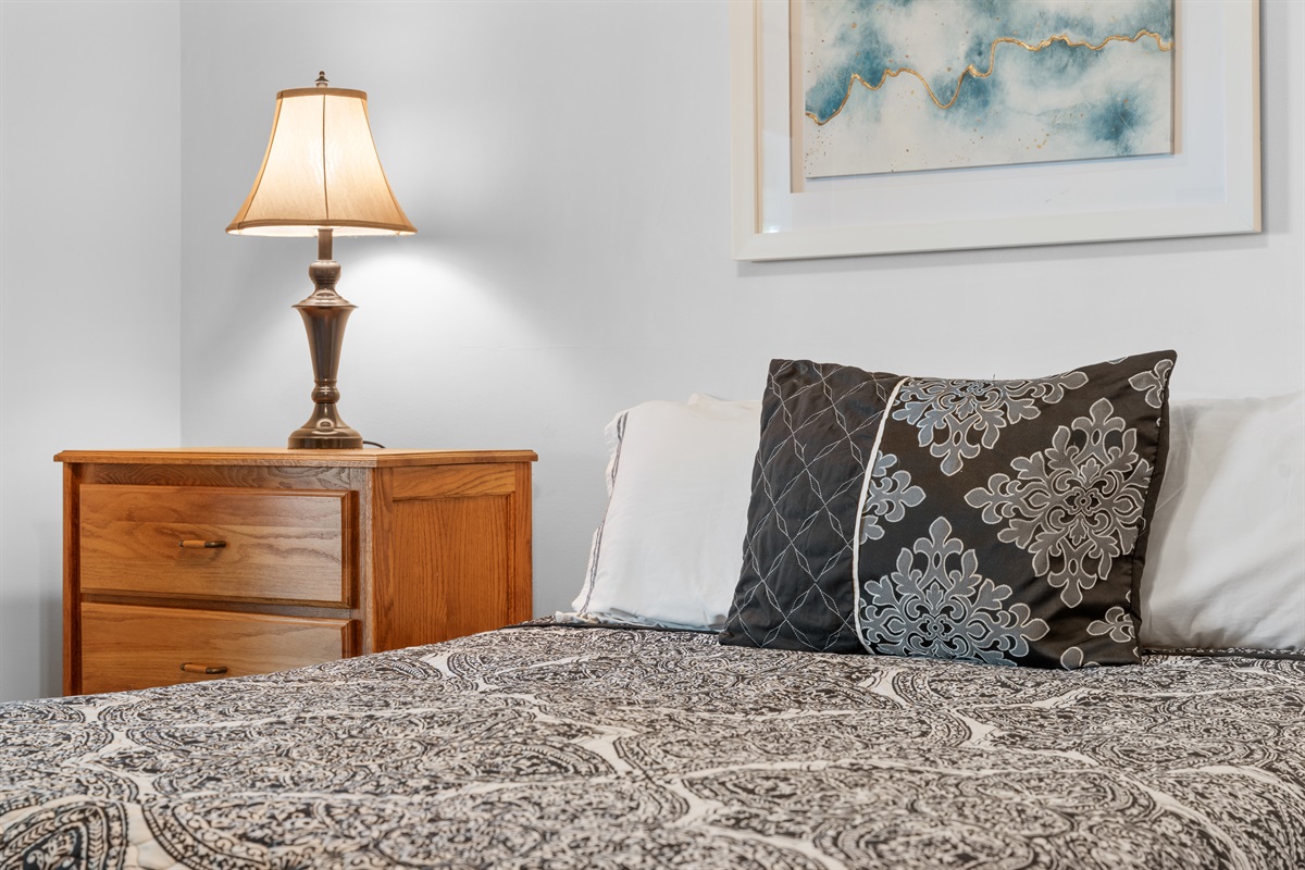 Layered bedding and soft textures help the bedrooms feel simple and restful.