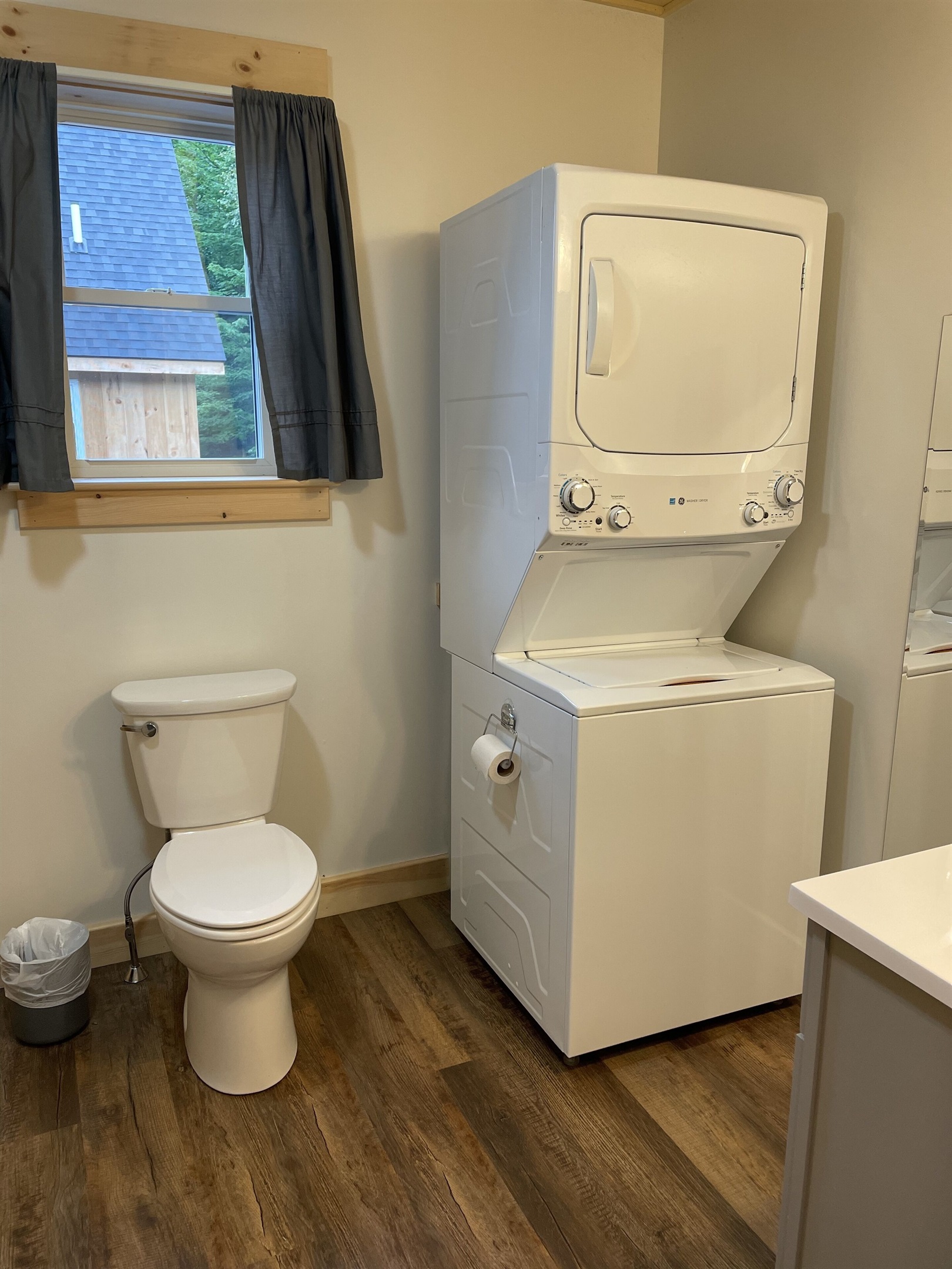 Full bathroom with washer and dryer