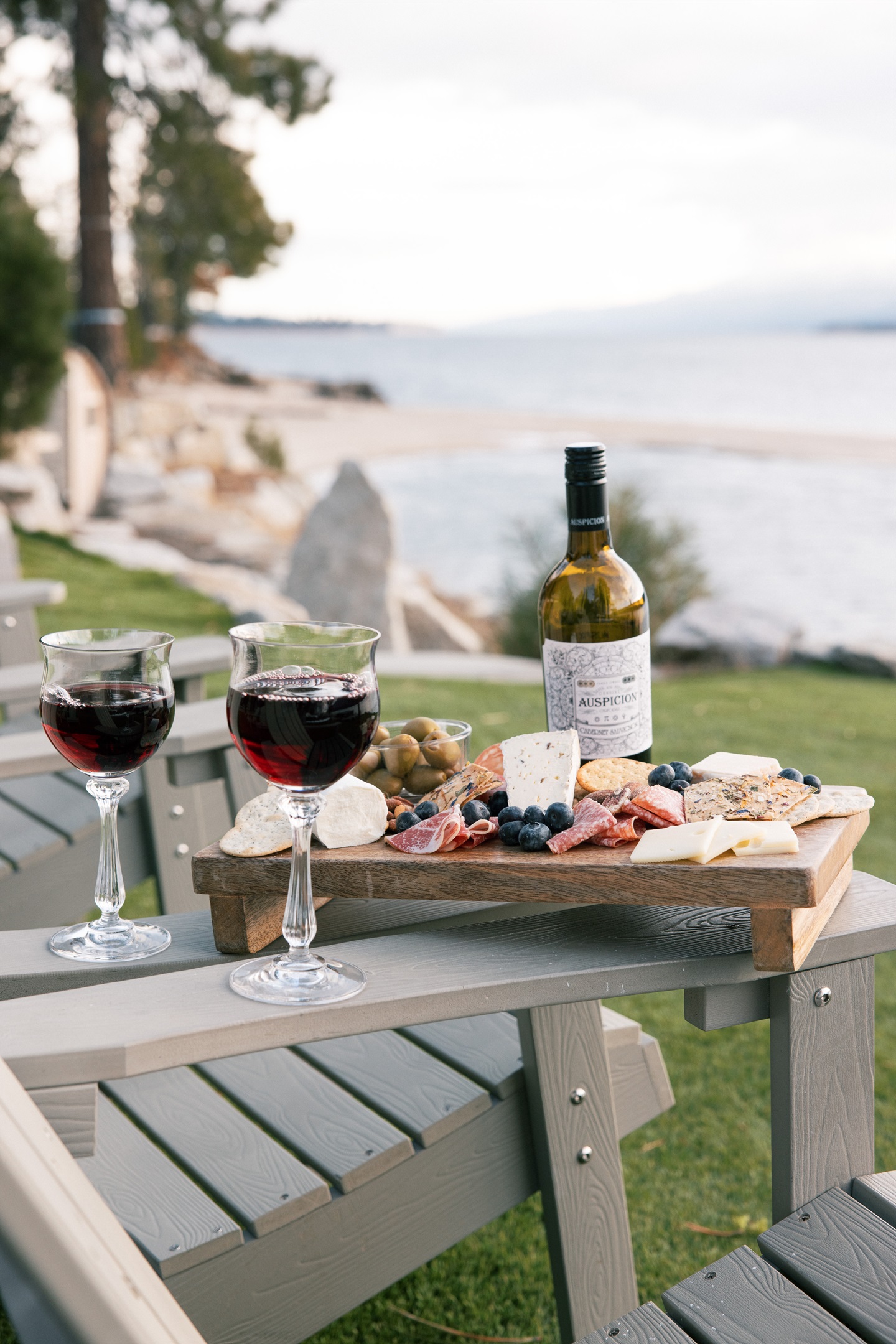 Unwind with elegance: Perfect pairing on your tranquil lakeside getaway.