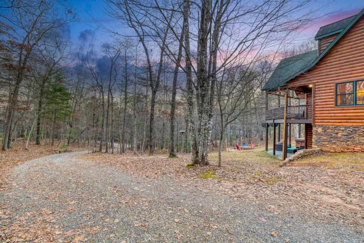 Exterior photo showcasing the house surrounded by natural beauty.
