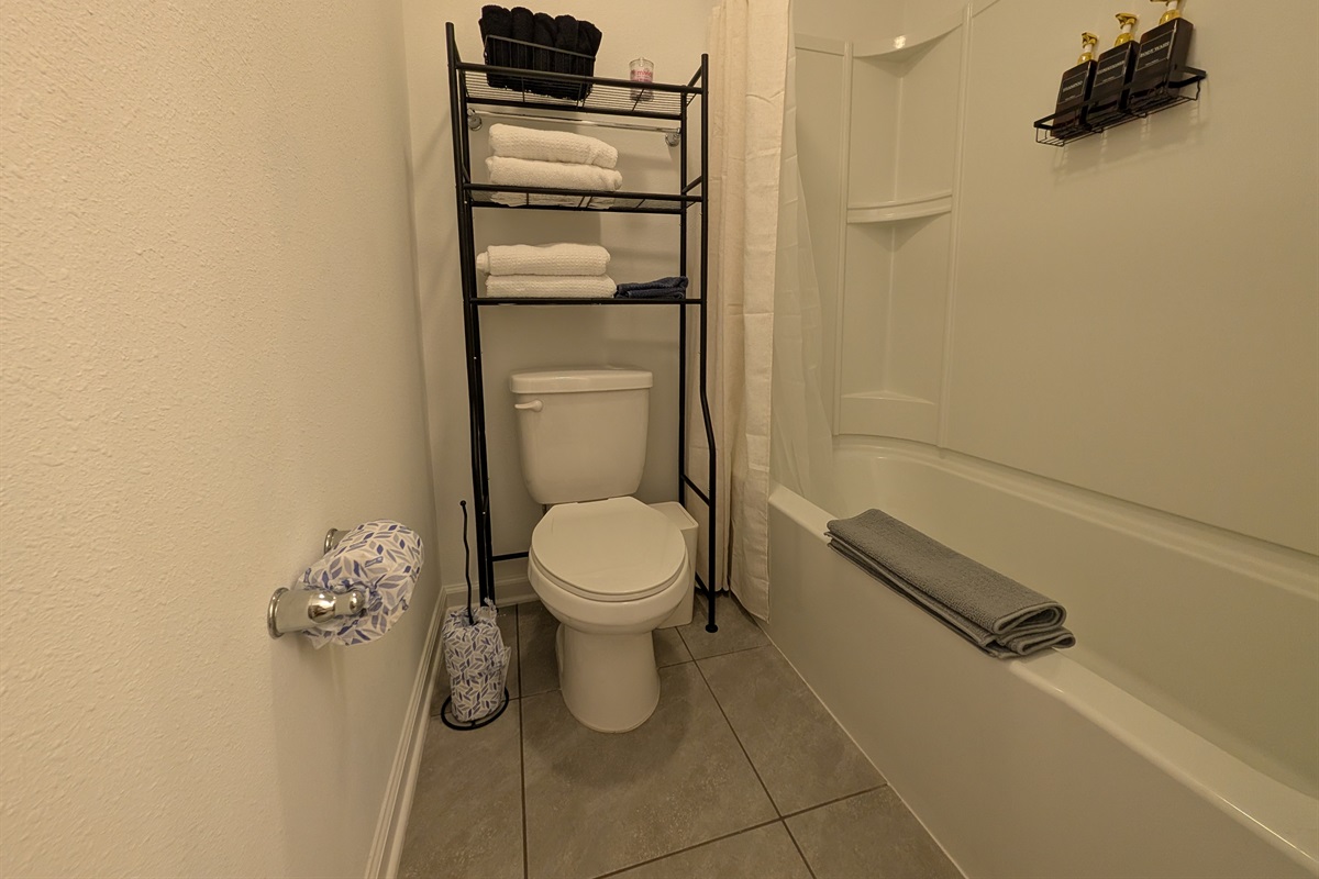 Guest full bathroom with shower and tub