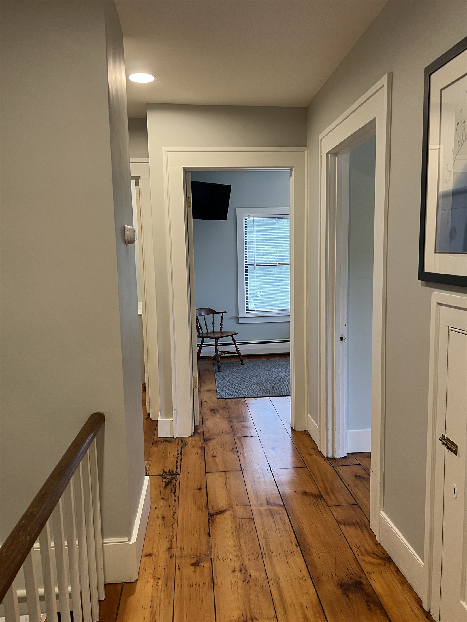 Cloverleaf Farm 2nd floor hallway with refinished original wide plank hardwood floors.