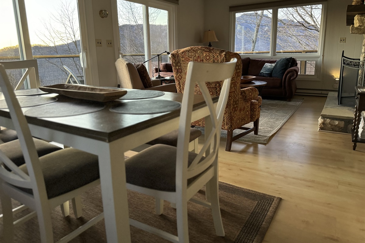 Dining with amazing views! Our dining table seats 6 (with 4 chairs + 1 bench that seats 2 more) & 4 barstools that are adjacent to this table, under the kitchen counter bar to seat 10 total.