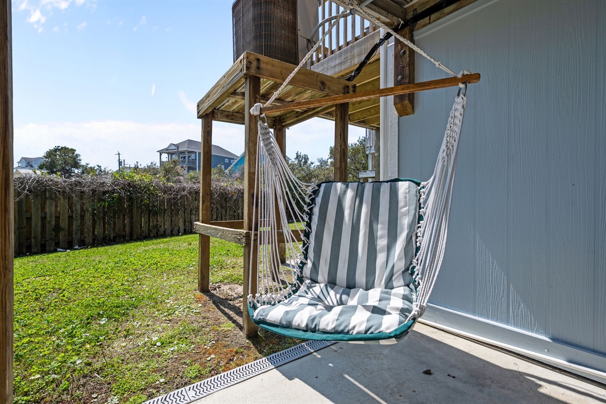 Outdoor hanging chair under the deck