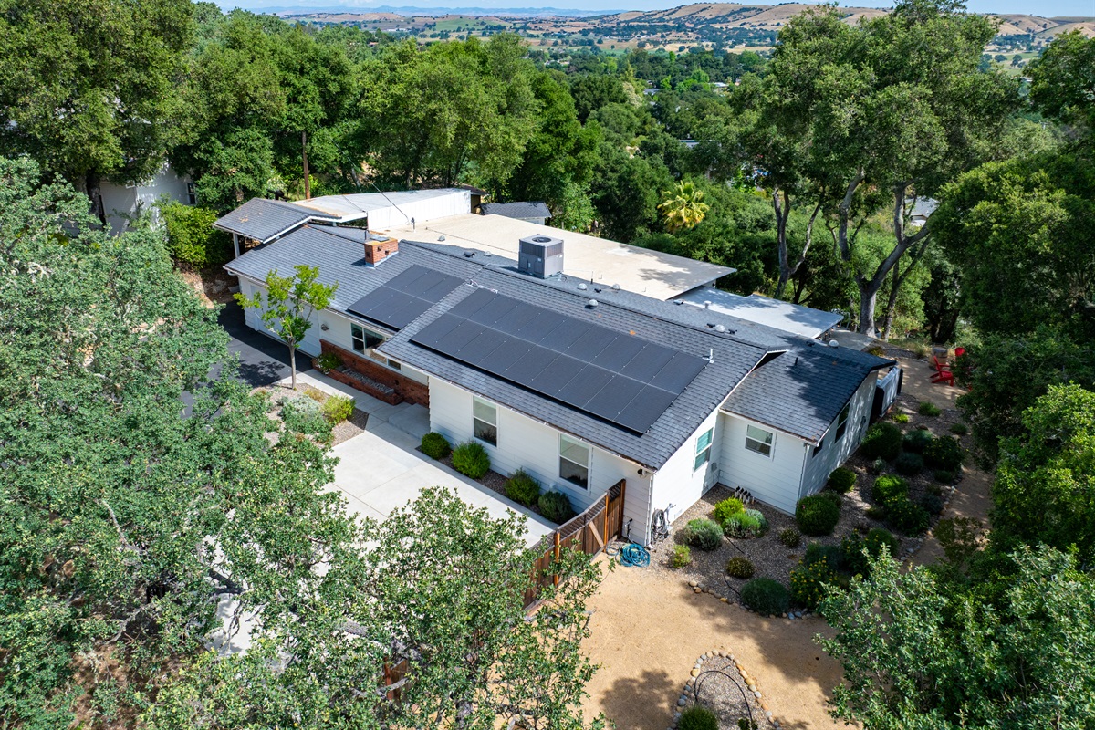 Your secluded hilltop escape, nestled among the oaks with views for miles.