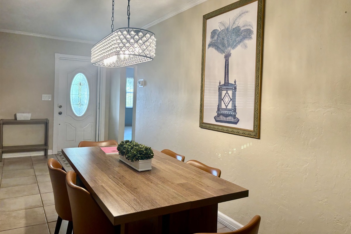 Gather around the table for family meals and games while enjoying the "Old Florida" palm.