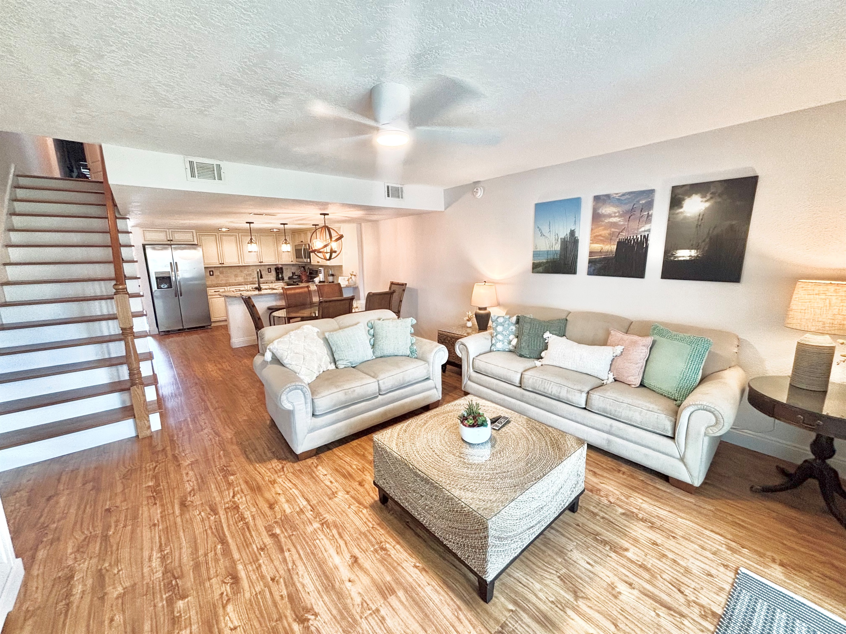 Living room with sleeper sofa and access to upstairs