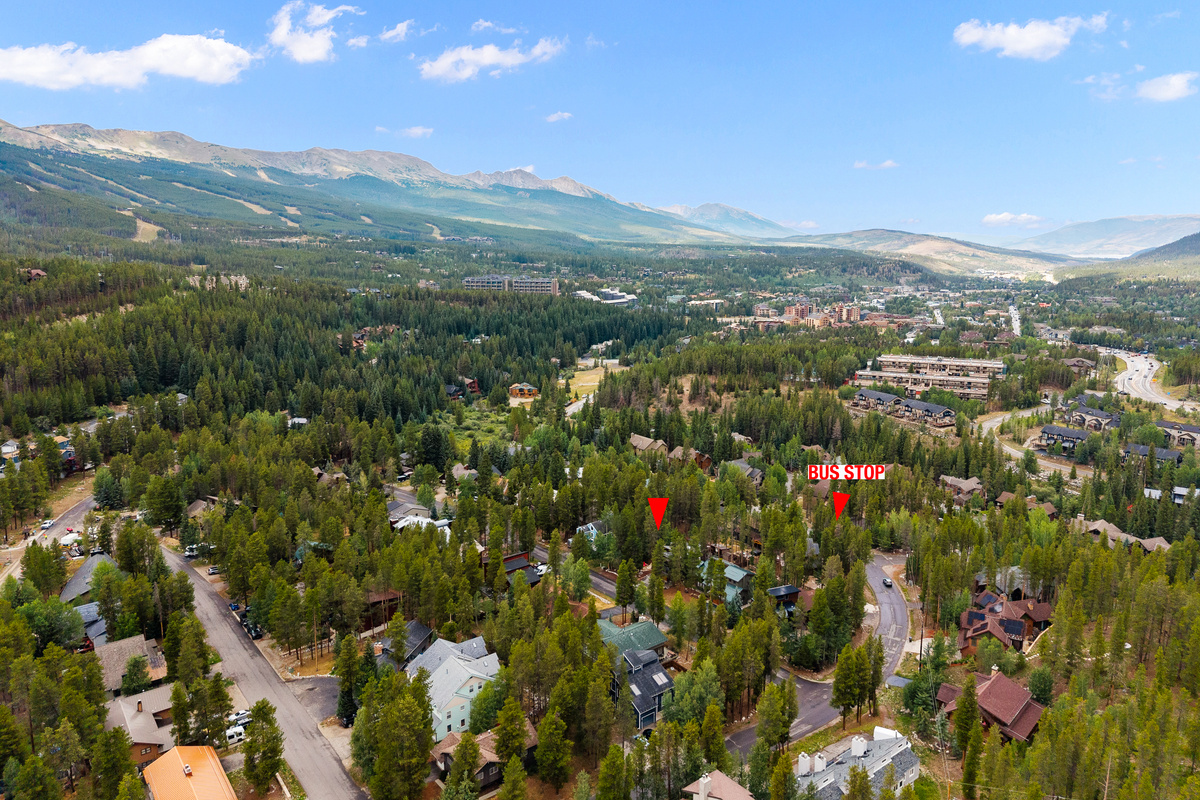Aerial view of the Arrow Darrow neighborhood. A FreeRide shuttle bus stop is less than 100 yards away on a flat, easy walk. Breckenridge Ski Resort and Main Street restaurants and shops are less than 1 mile away. Arrow Darrow is tucked into the trees. 