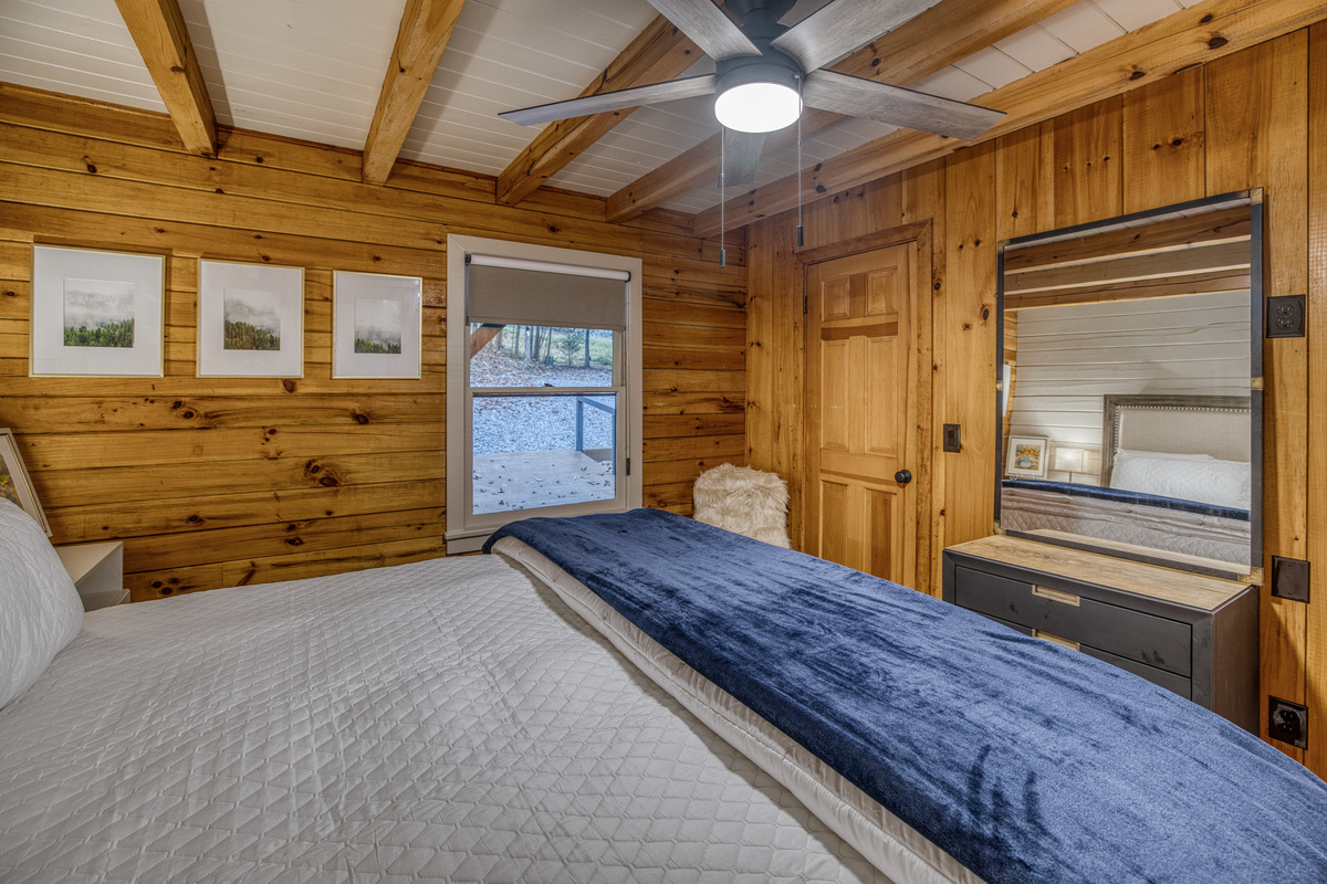 Bedroom with a window and soft bedding.