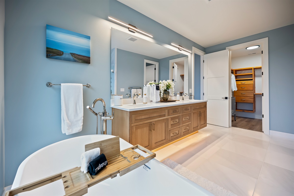 Bathroom #7 of 8 - Upstairs, ensuite to the primary bedroom with soaking tub, walk in shower, and lake views and access to the walk-in closet
