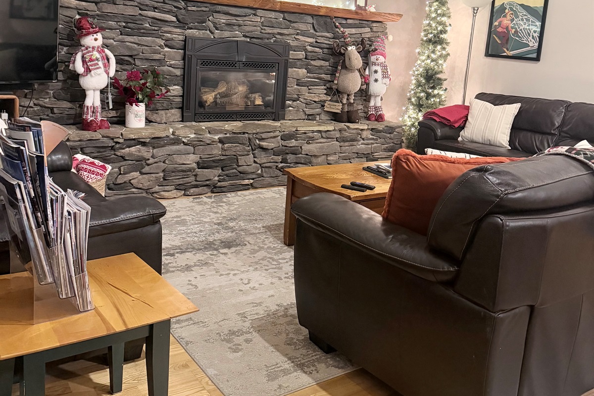 Cuddle up by the fire in the cozy living room 
