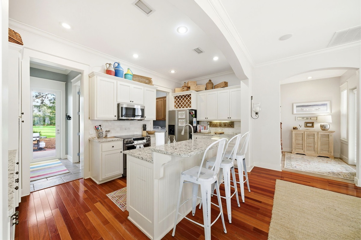 This spacious kitchen comes with a granite island for additional cooking or seating space. 