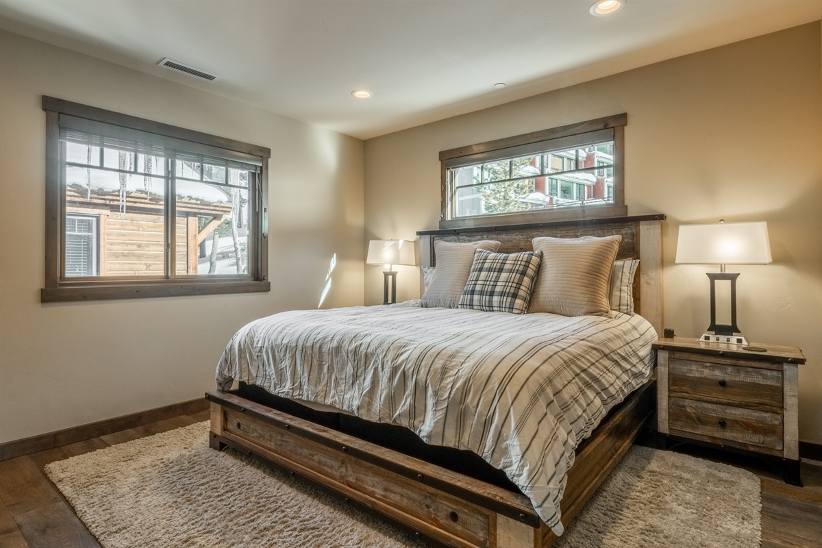 Bathed in natural light, the second primary suite offers comfort and its own private bath.