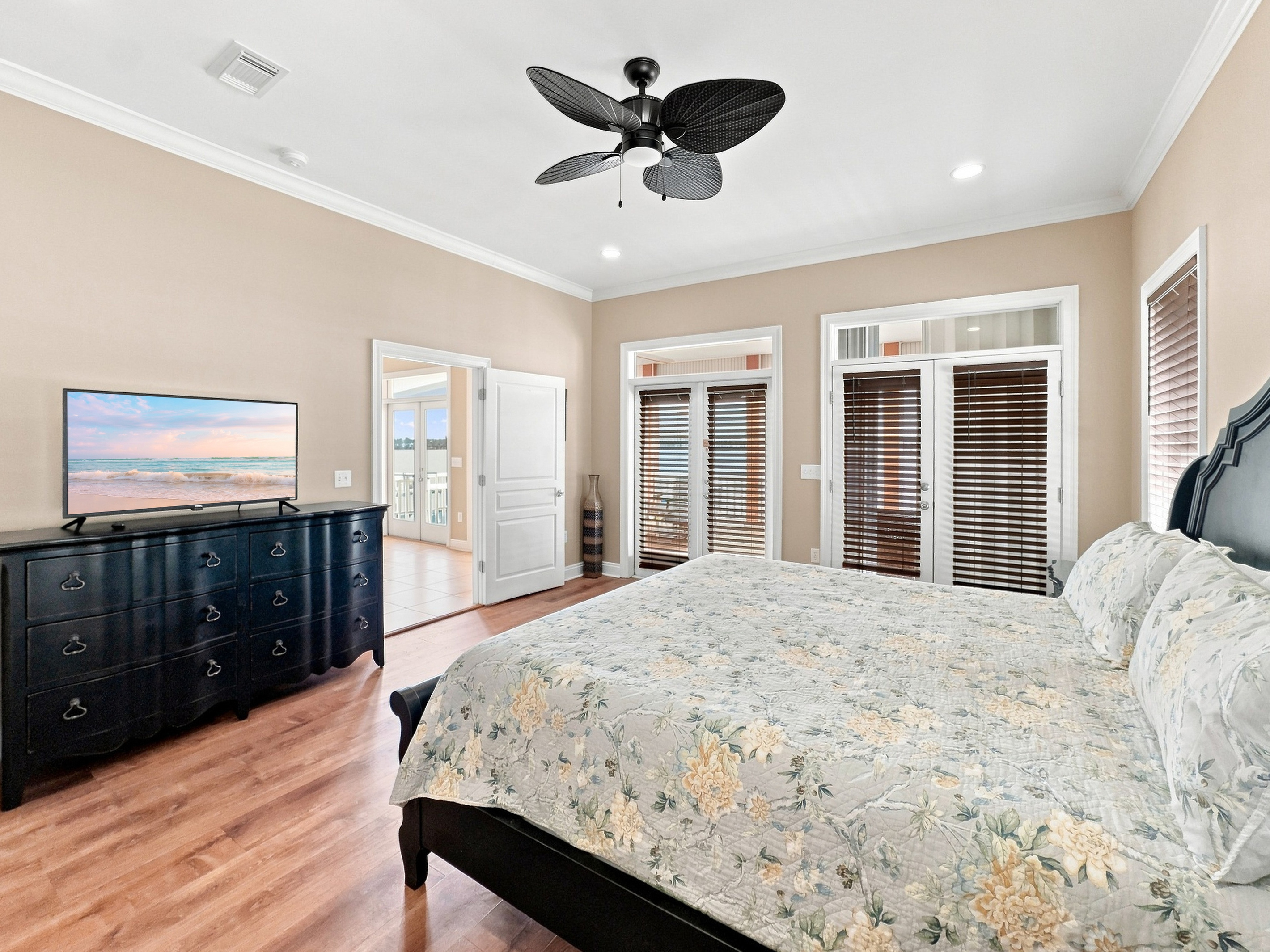 Bedroom with plantation shutters and lagoon views