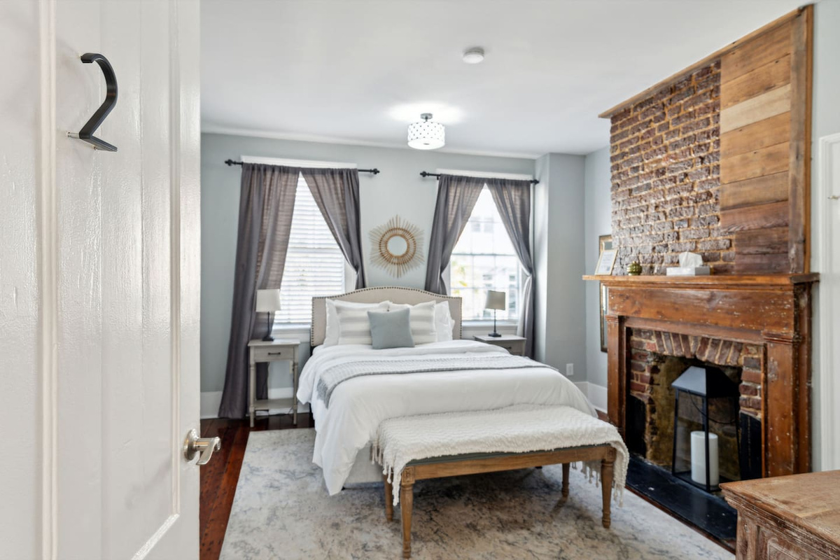 Bedroom #2 on second floor has a Queen sized bed, fireplace feature, attached en-suite full bath with bathtub/shower combo, closet and dresser. Equipped with soaps, shampoo & conditioner, and hair dryer.