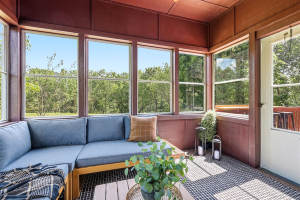 The sunroom leads to the deck...