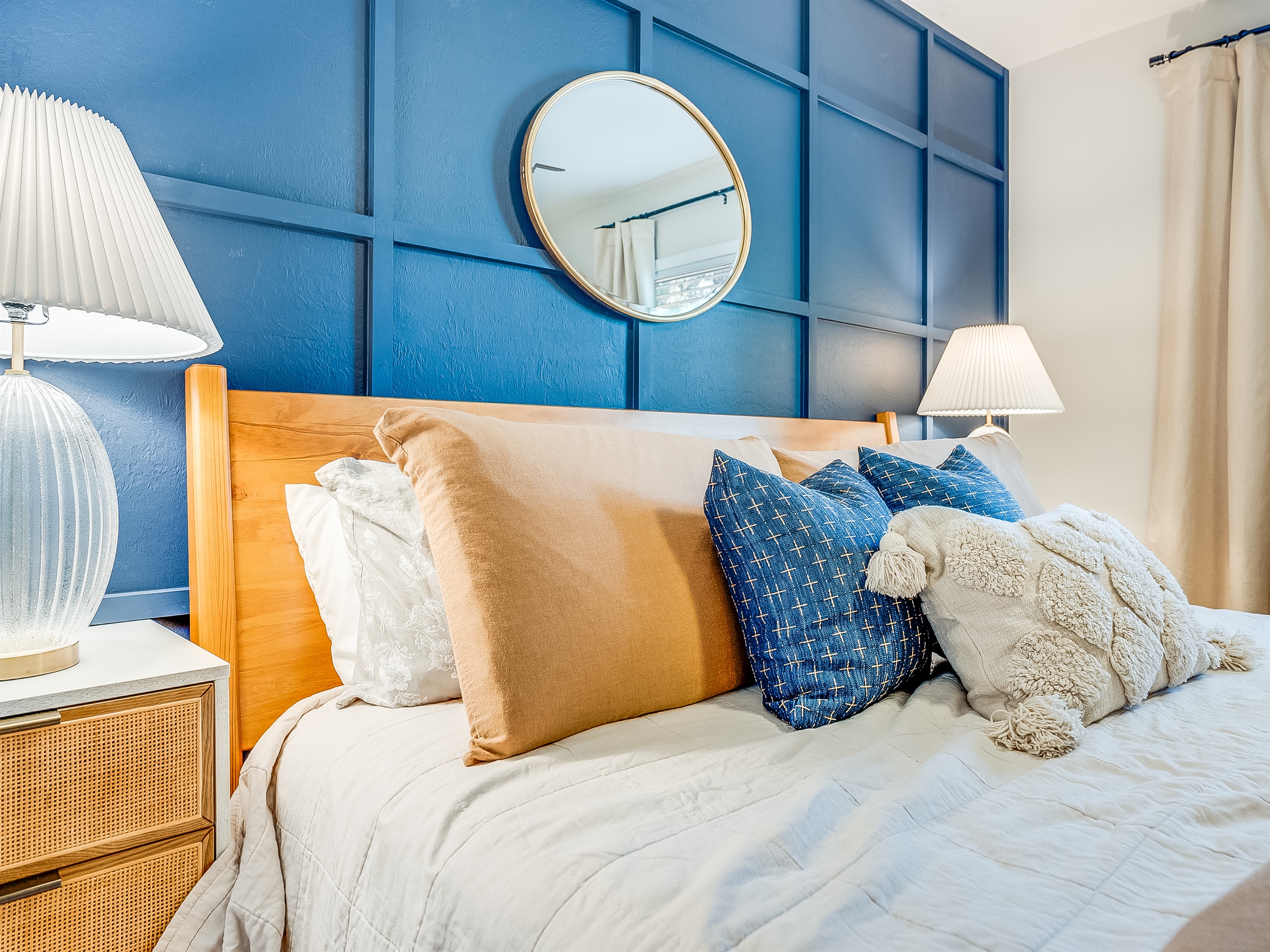A bold blue accent wall adds a splash of personality.